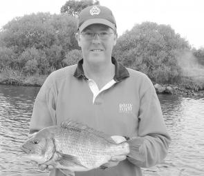Jason Jeffrey with a 2kg bream from the Tambo River. It was a PB for Jason, and ate an Ecogear SX-40 lure. The bream fishing in the Gippsland Lakes has been sensational, and should get even better as the floodwaters clear (photo: Shane Jeffrey).